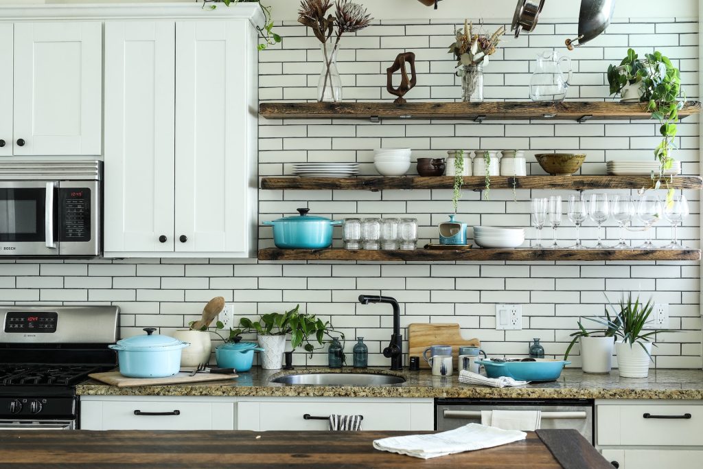 kitchen with subway tile and open shelving